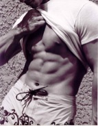 Jaacob Bowden shows off his abs during a fitness model photo shoot in 2002