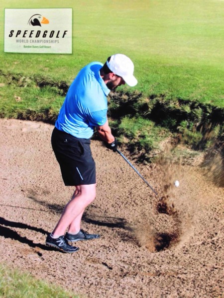 Jaacob Bowden hits a bunker shot during the 2013 Speedgolf World Championships at Bandon Dunes