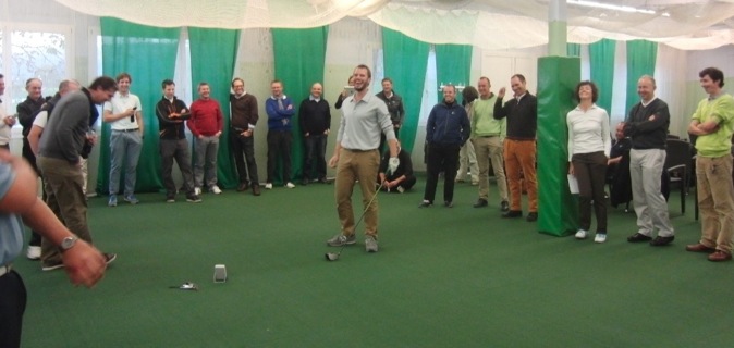 Jaacob Bowden has a laugh with a group of Swiss PGA pros during a swing speed training clinic