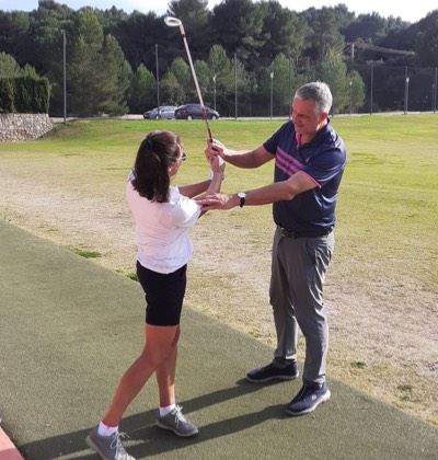 H. Falke teaching a golf student